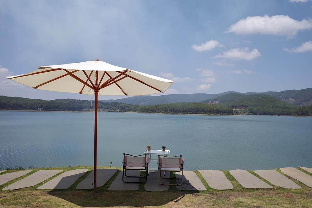 Enjoy a cup of coffee in Tuyen Lam lake bank