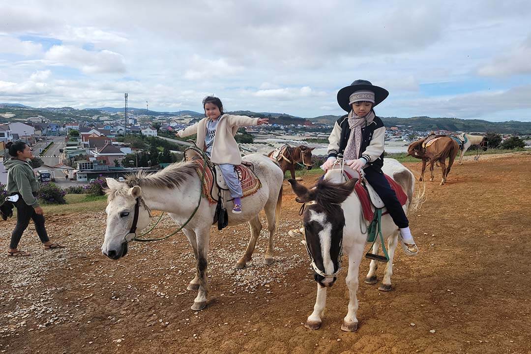 Ride a horse at Lang Bian Tourist area