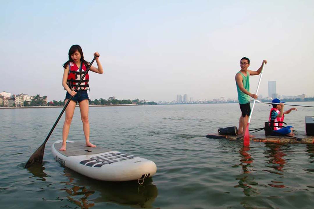 Try stand up paddle in West Lake