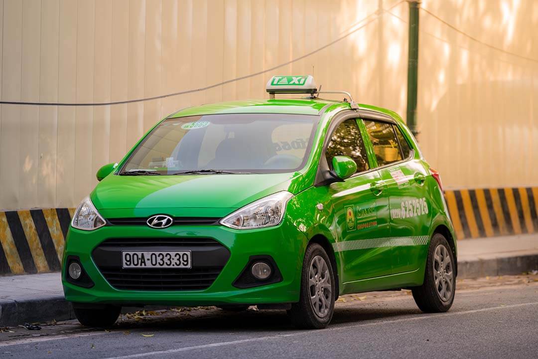 Mai Linh taxi cab sits in the streets of Hanoi