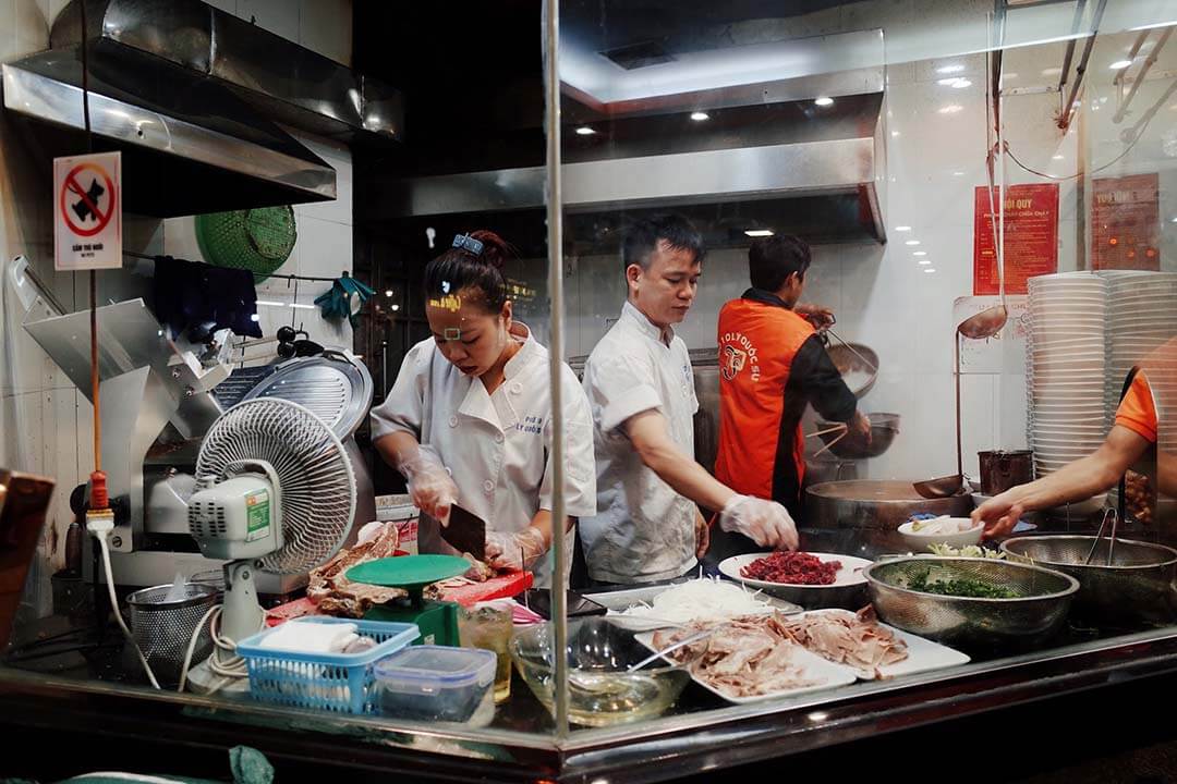 Open kitchen space at the restaurant inside Pho 10 Ly Quoc Su