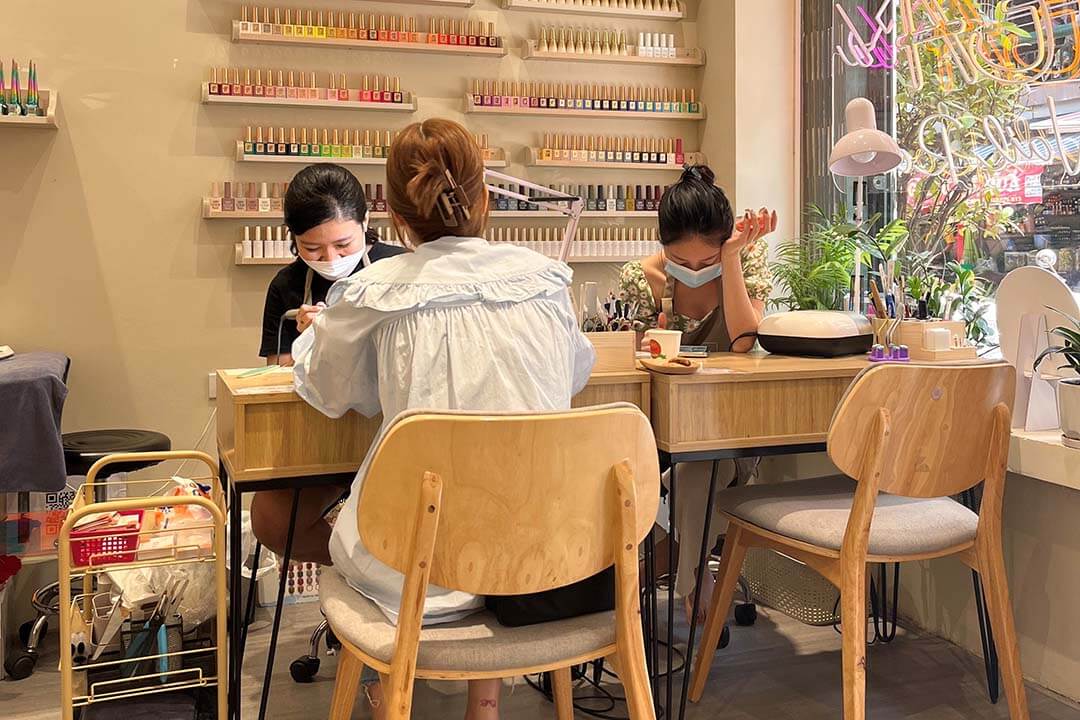 Technician is designing nails for a customer