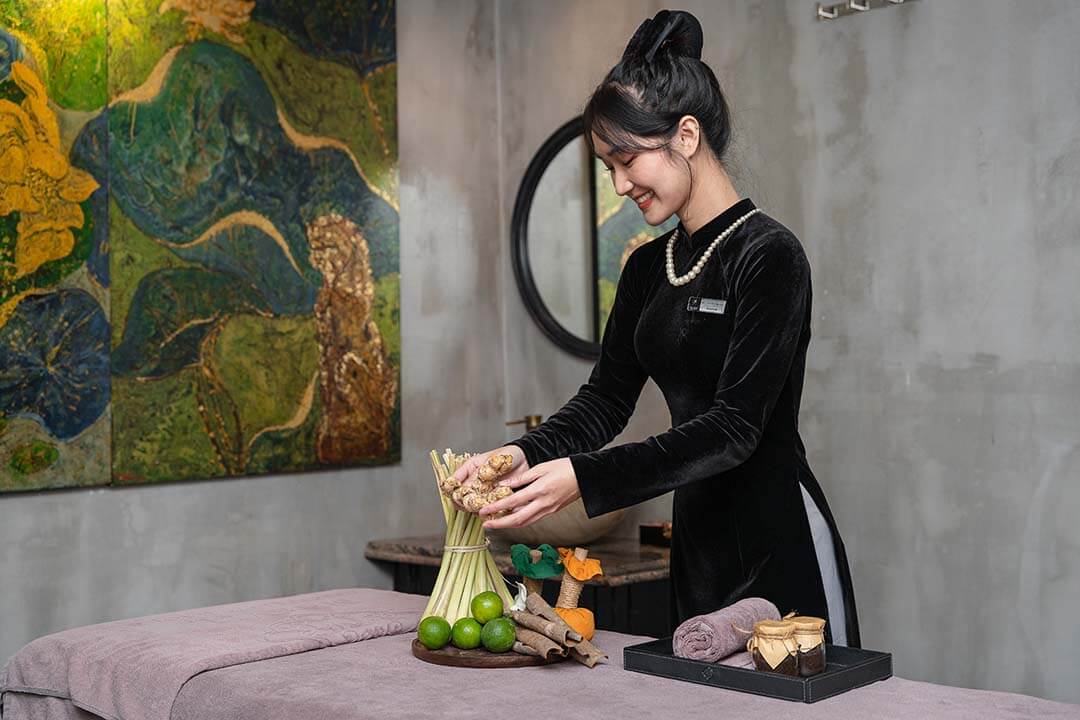 Technicians are preparing natural ingredients for a massage session at JM Spa Hanoi